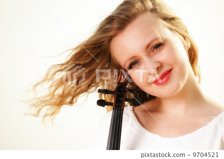The blonde girl with a violin outdoor 9704521