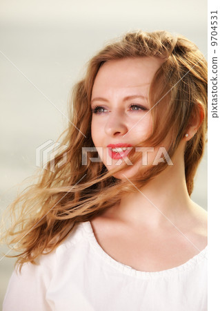 young woman wind in hair outdoor young woman wind in hair outdoor 9704531
