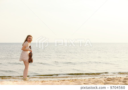Happy blonde girl with a violin outdoor Happy blonde girl with a violin outdoor 9704560