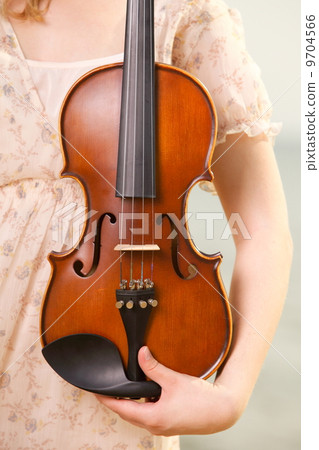 Female hand with a violin outdoor 9704566