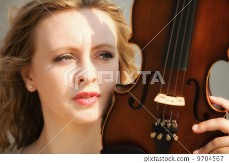 Portrait blonde girl with a violin outdoor Portrait blonde girl with a violin outdoor 9704567