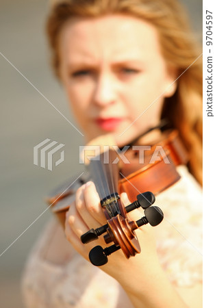 Portrait blonde girl with a violin outdoor Portrait blonde girl with a violin outdoor 9704597