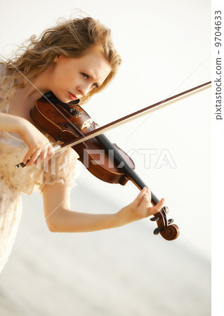 Portrait blonde girl with a violin outdoor Portrait blonde girl with a violin outdoor 9704633