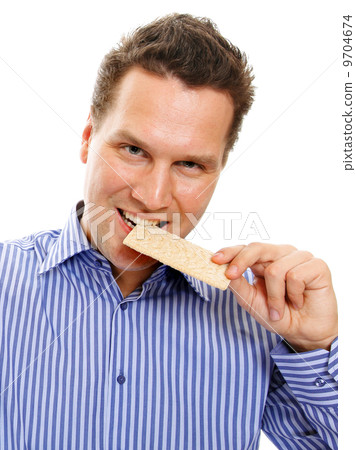Healthy lifestyle man eating crispbread isolated Healthy lifestyle man eating crispbread isolated 9704674