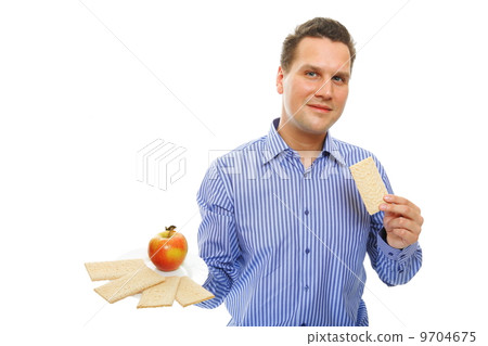 Healthy lifestyle man eating crispbread and apple 9704675