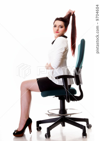 Portrait serious business woman sitting on chair 9704684