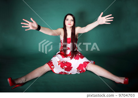 young woman with outstretched arms 9704703