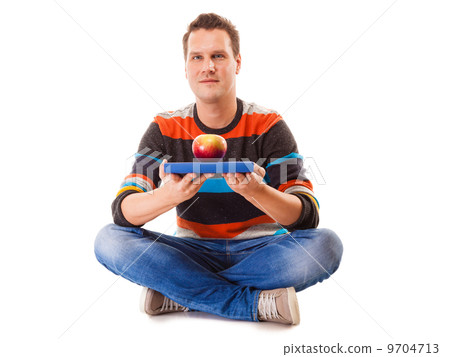 Man holding book and red apple. Healthy mind and body 9704713