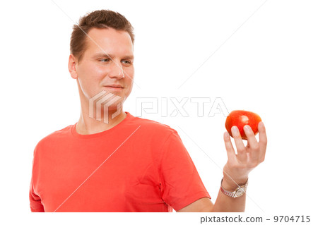 Happy man in red shirt holding apple. Diet health care healthy nutrition. Happy man in red shirt holding apple. Diet health care healthy nutrition. 9704715