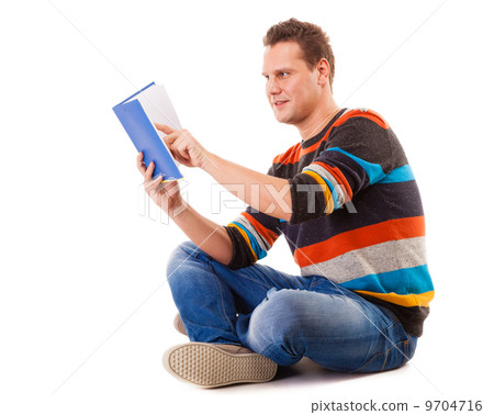 male student reading a book preparing for exam isolated male student reading a book preparing for exam isolated 9704716