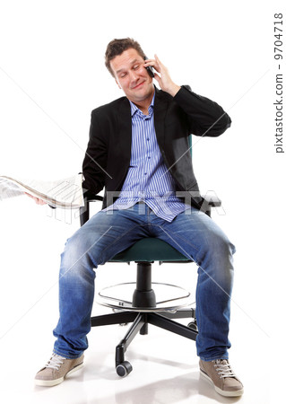 man reads newspaper phoning - economy news 9704718