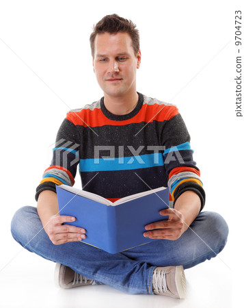 young man reading a book on the floor isolated 9704723