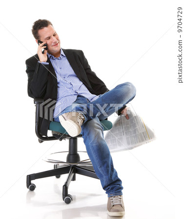 man reads newspaper phoning - economy news 9704729