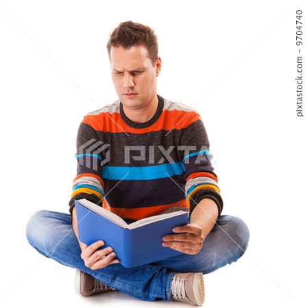 male student reading a book preparing for exam isolated male student reading a book preparing for exam isolated 9704740
