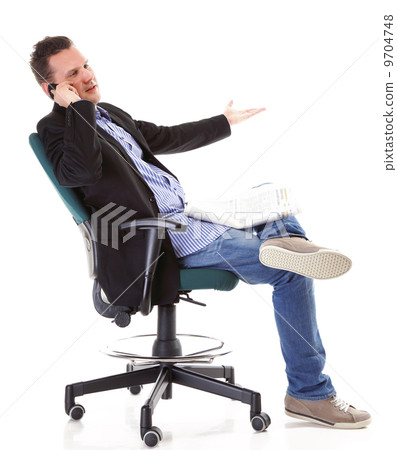 man reads newspaper phoning - economy news 9704748