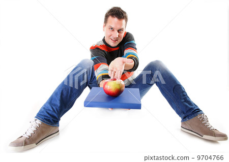 Man holding a book and one red apple full body 9704766