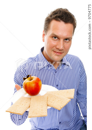 Healthy lifestyle man eating crispbread and apple 9704775