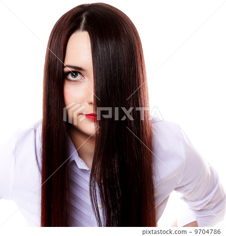 Woman covers part of face by straight long hair 9704786