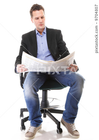 Businessman reading a newspaper isolated 9704807