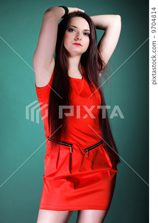 woman long hair red dress on green fashion 9704814