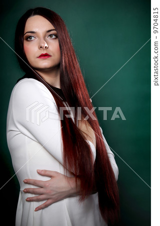 Woman straight long hair make-up posing Woman straight long hair make-up posing 9704815