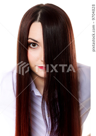 Woman covers part of face by straight long hair 9704828
