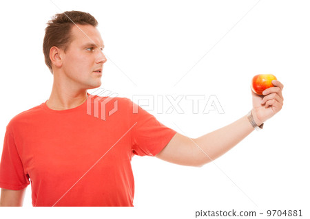 Happy man in red shirt holding apple. Diet health care healthy nutrition. Happy man in red shirt holding apple. Diet health care healthy nutrition. 9704881