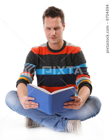 young man reading a book on the floor isolated 9704894