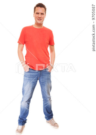 Young man guy red t-shirt jaens with hands in pockets isolated Young man guy red t-shirt jaens with hands in pockets isolated 9705087