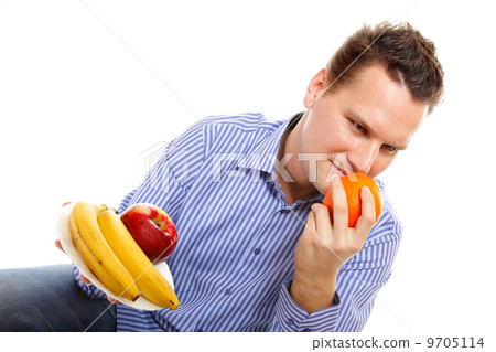 young man with fruits isolated young man with fruits isolated 9705114