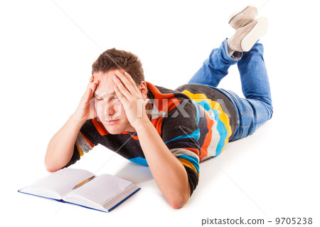 tired college student preparing hard work for exam 9705238