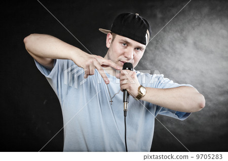 Rap singer man with microphone cool hand gesture 9705283
