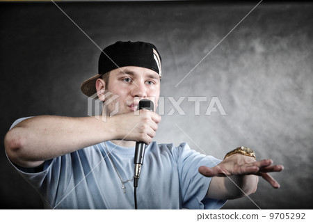 Rap singer man with microphone cool hand gesture Rap singer man with microphone cool hand gesture 9705292