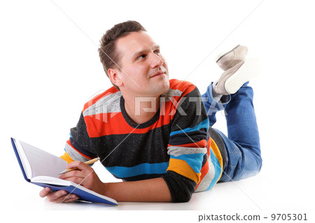 young man reading a book on the floor isolated 9705301