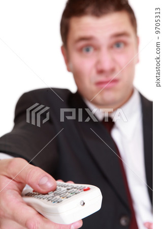 man with remote control changing channel 9705313