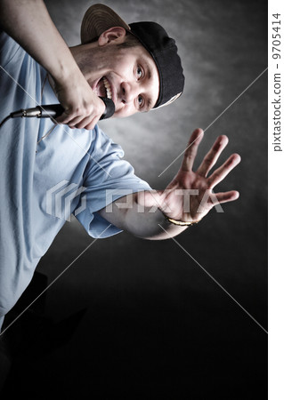 Rap singer man with microphone cool hand gesture 9705414