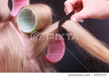 Female blond hair head curlers rollers hairdresser beauty salon 9705537