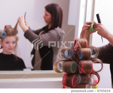 Beautiful blond girl hair curlers rollers hairdresser beauty salon Beautiful blond girl hair curlers rollers hairdresser beauty salon 9705634