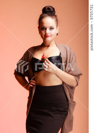 Beautiful woman fashion girl with red lips holds chilli pepper Beautiful woman fashion girl with red lips holds chilli pepper 9705781