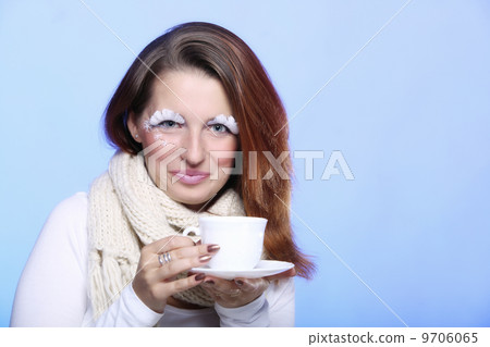 Winter makeup woman with cup of hot beverge 9706065