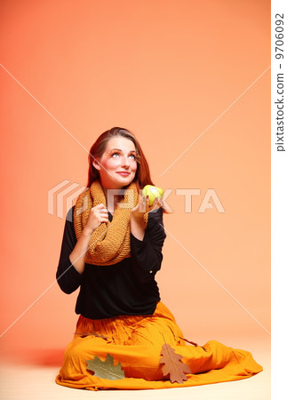 Autumn fashion girl with apple orange eye-lashes Autumn fashion girl with apple orange eye-lashes 9706092