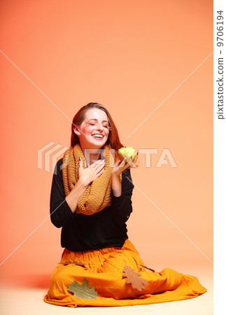 Autumn fashion girl with apple orange eye-lashes Autumn fashion girl with apple orange eye-lashes 9706194