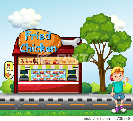 A young boy near the fried chicken store A young boy near the fried chicken store 9706980