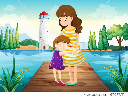 A young girl hugging her mother at the bridge A young girl hugging her mother at the bridge 9707851