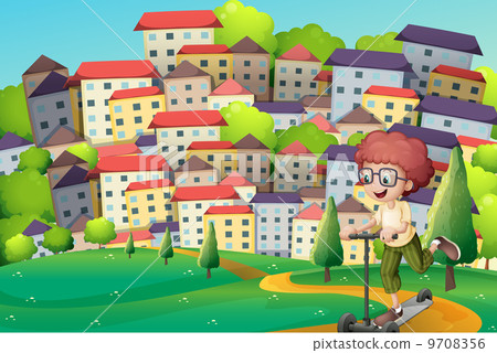 A happy boy playing with a scooter at the hills 9708356