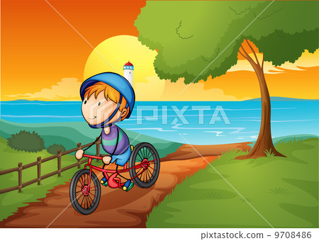 A young boy biking near the river A young boy biking near the river 9708486