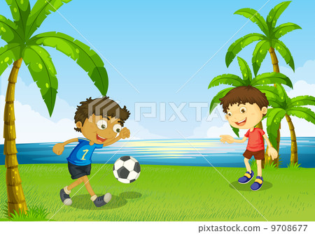 Boys playing football at the riverbank 9708677
