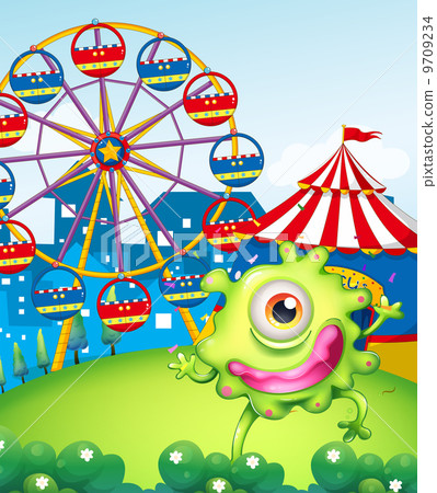 A one-eyed green monster at the carnival in the hilltop A one-eyed green monster at the carnival in the hilltop 9709234