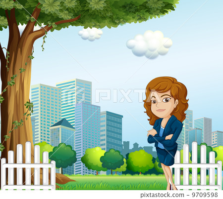A girl relaxing on her breaktime near the tree A girl relaxing on her breaktime near the tree 9709598