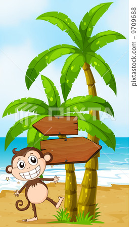 A beach with a smiling elephant near the wooden signboard 9709688